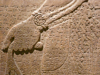 Assyrian bas relief with cuneiform inscriptions